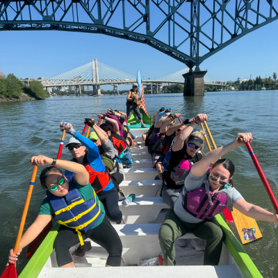 ridgefield wa dragonboat crew rowing under a bridge