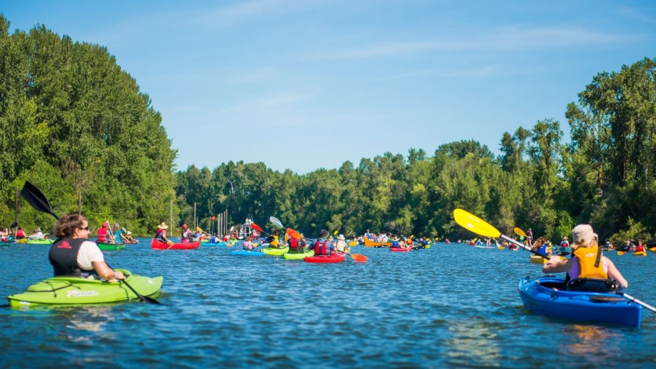 Kayakers and paddlers on Lake River at the Ridgefield Big Paddle Waterfront Festival