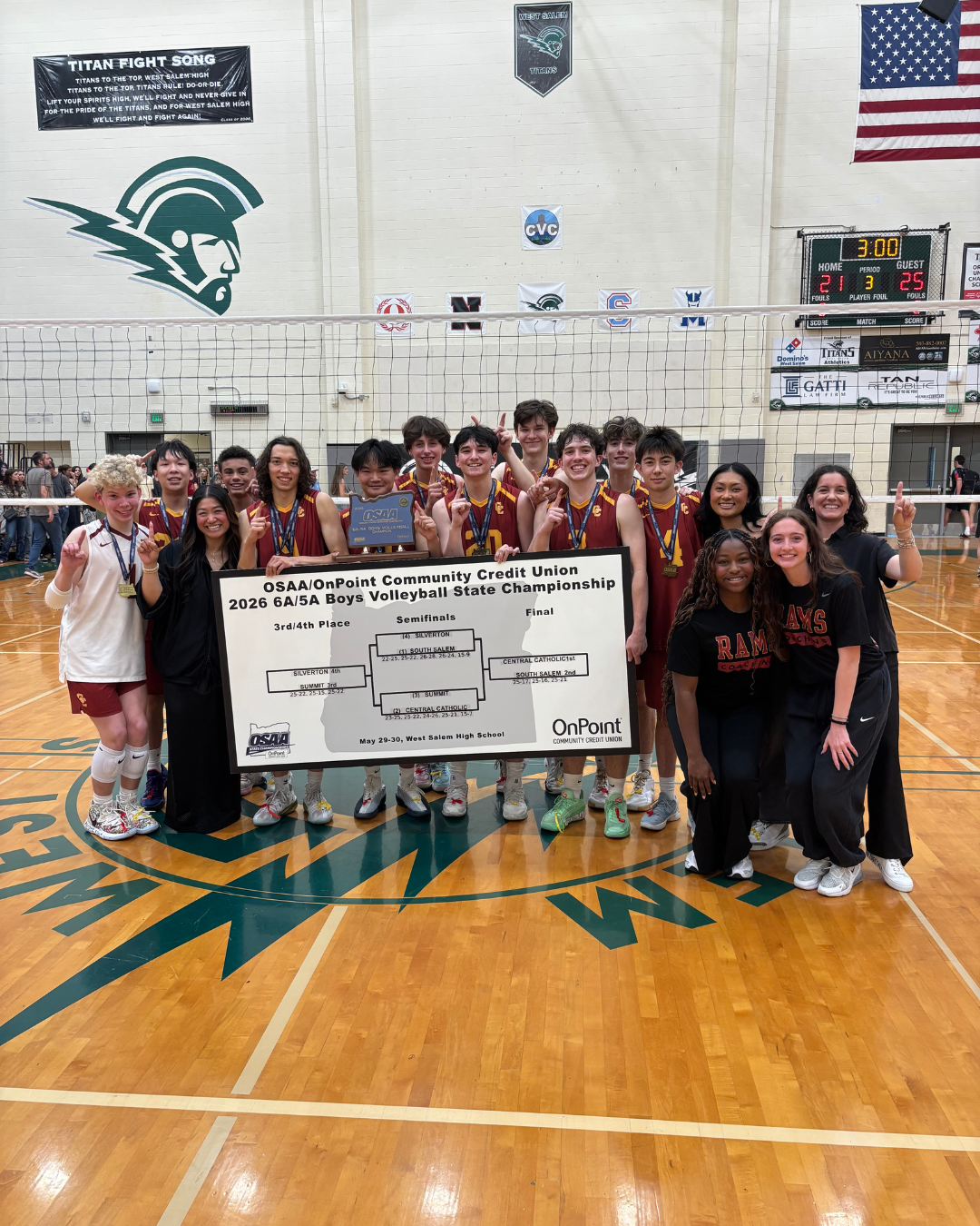 Central Catholic boys volleyball team celebrating with the 2026 Oregon state championship trophy
