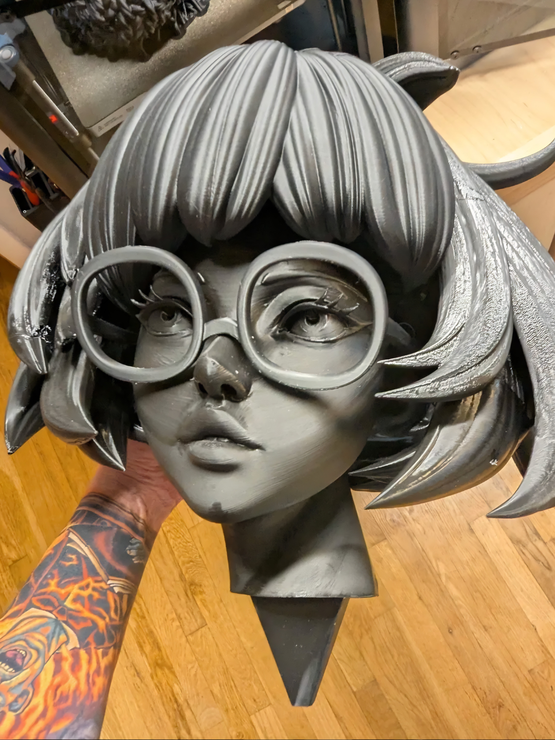 An unpainted 3D-printed Velma head from Scooby-Doo — one of Jason Morris's works in progress