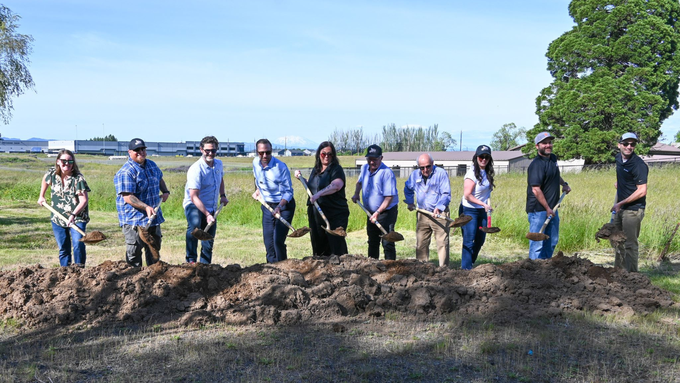 Ridgefield city council members ceremonially break ground with shovels