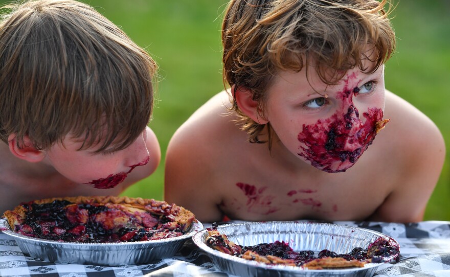 Boys competing in the Ridgefield 4th of July pie eating contest