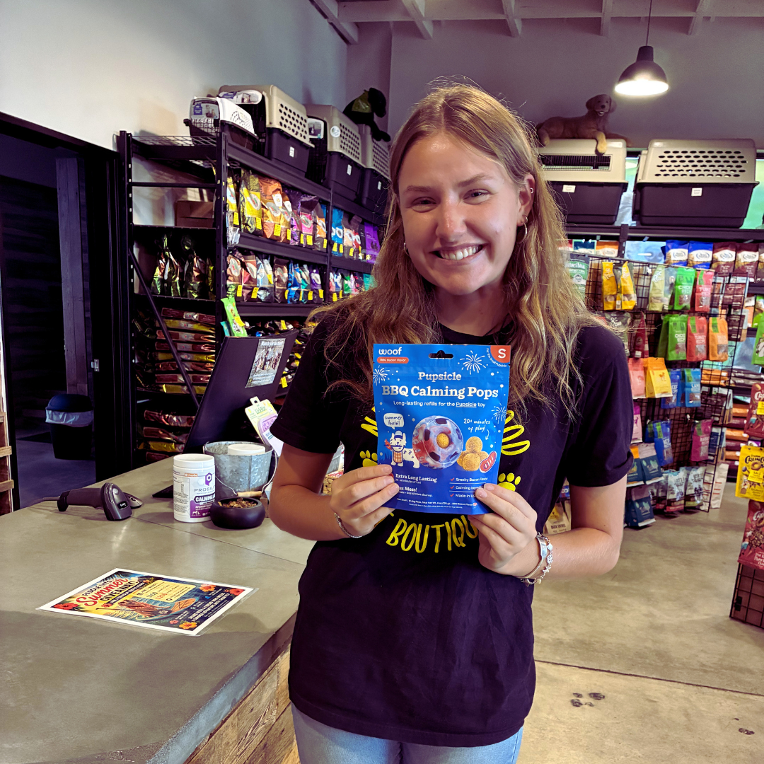 Brooklyn from Woodin' You in Ridgefield holding a Woof Pupsicle and BBQ calming pops