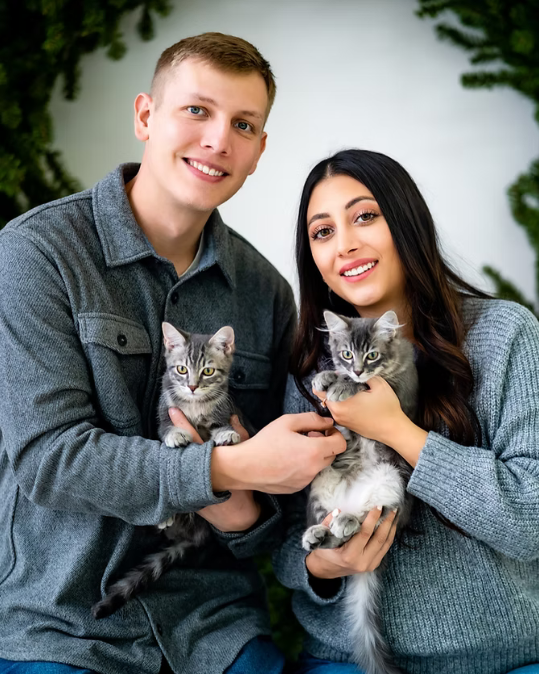 Rivers and Daniela with their two cats