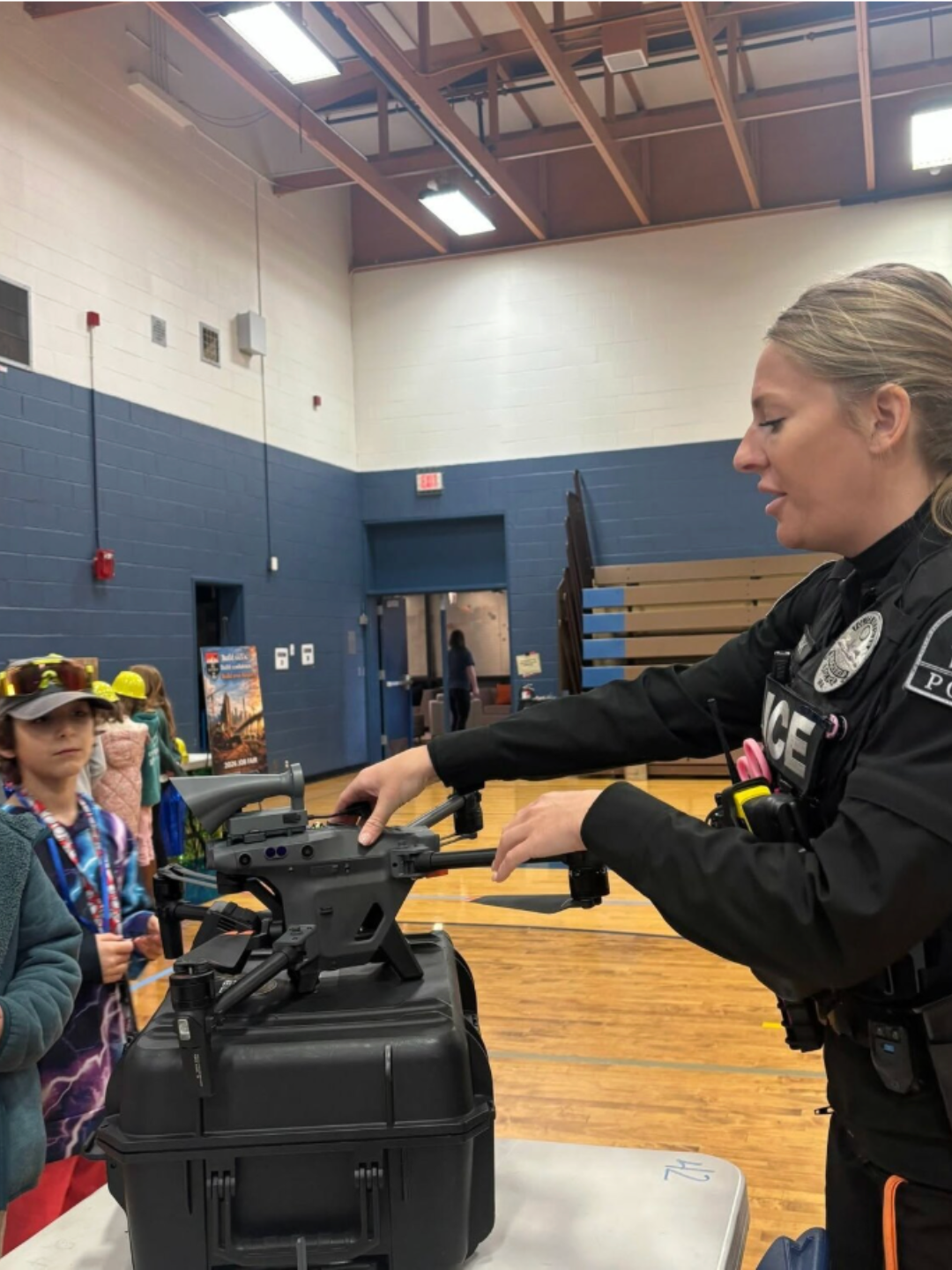 Ridgefield police officer Kaylin Debiak with the Police Activities League van after receiving her Law Enforcement Volunteer of the Quarter award