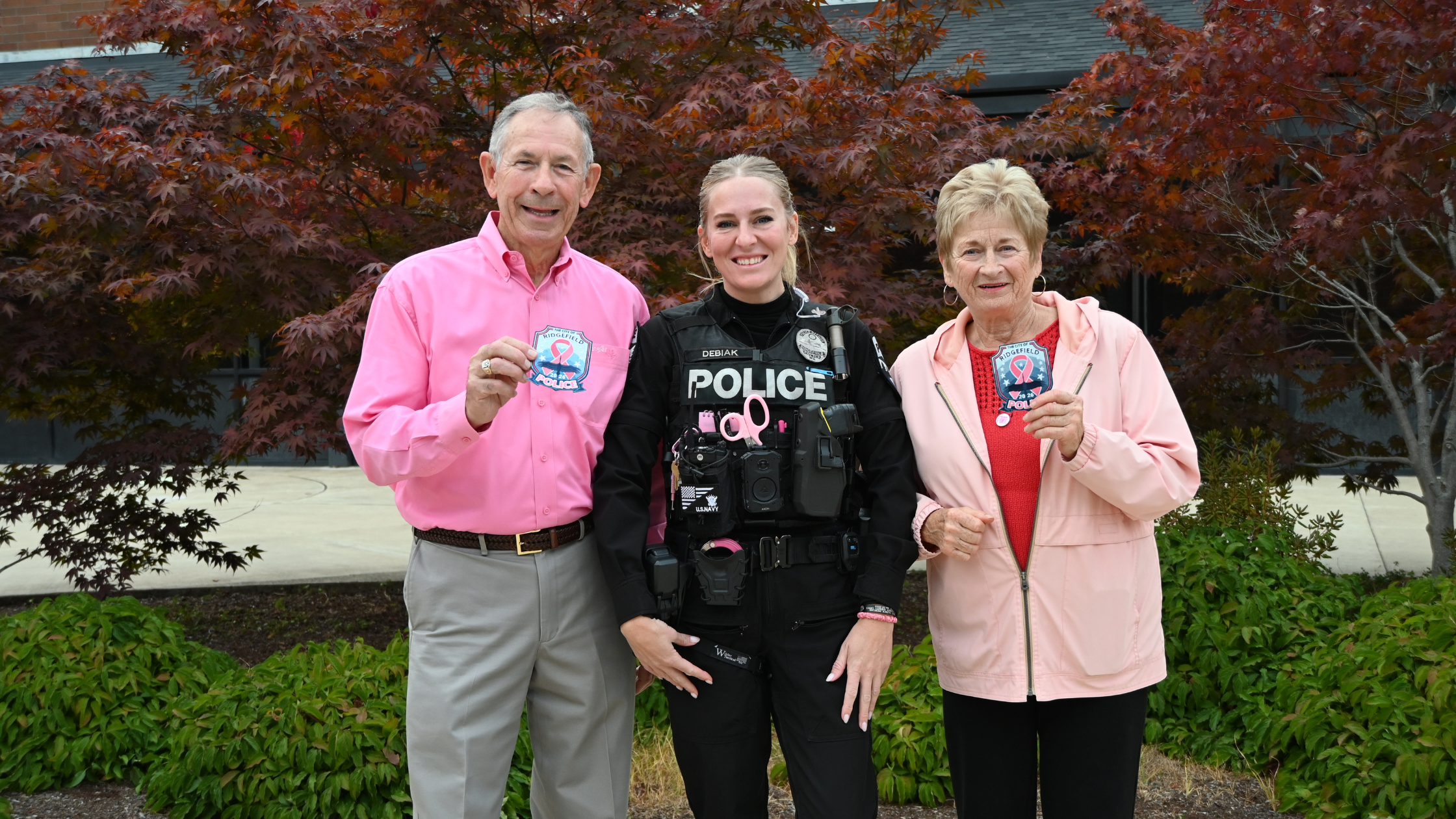 Officer Kaylin Debiak revealing the 2026 pink patch at Ridgefield City Council
