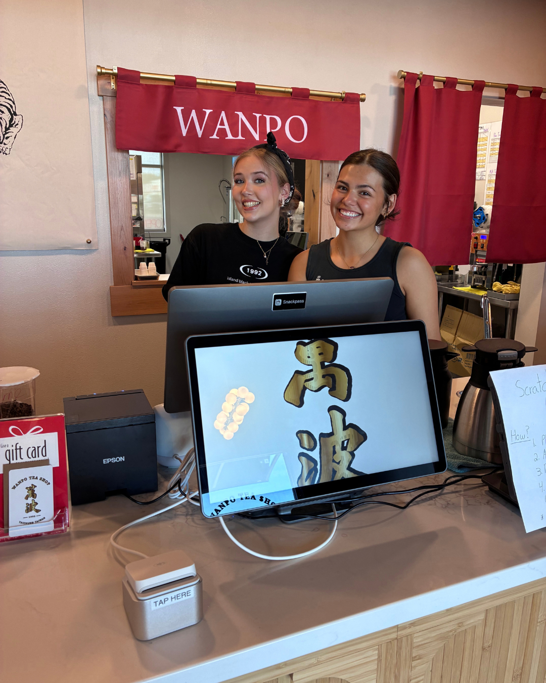 Staff behind the counter at Wanpo Tea Shop in Ridgefield
