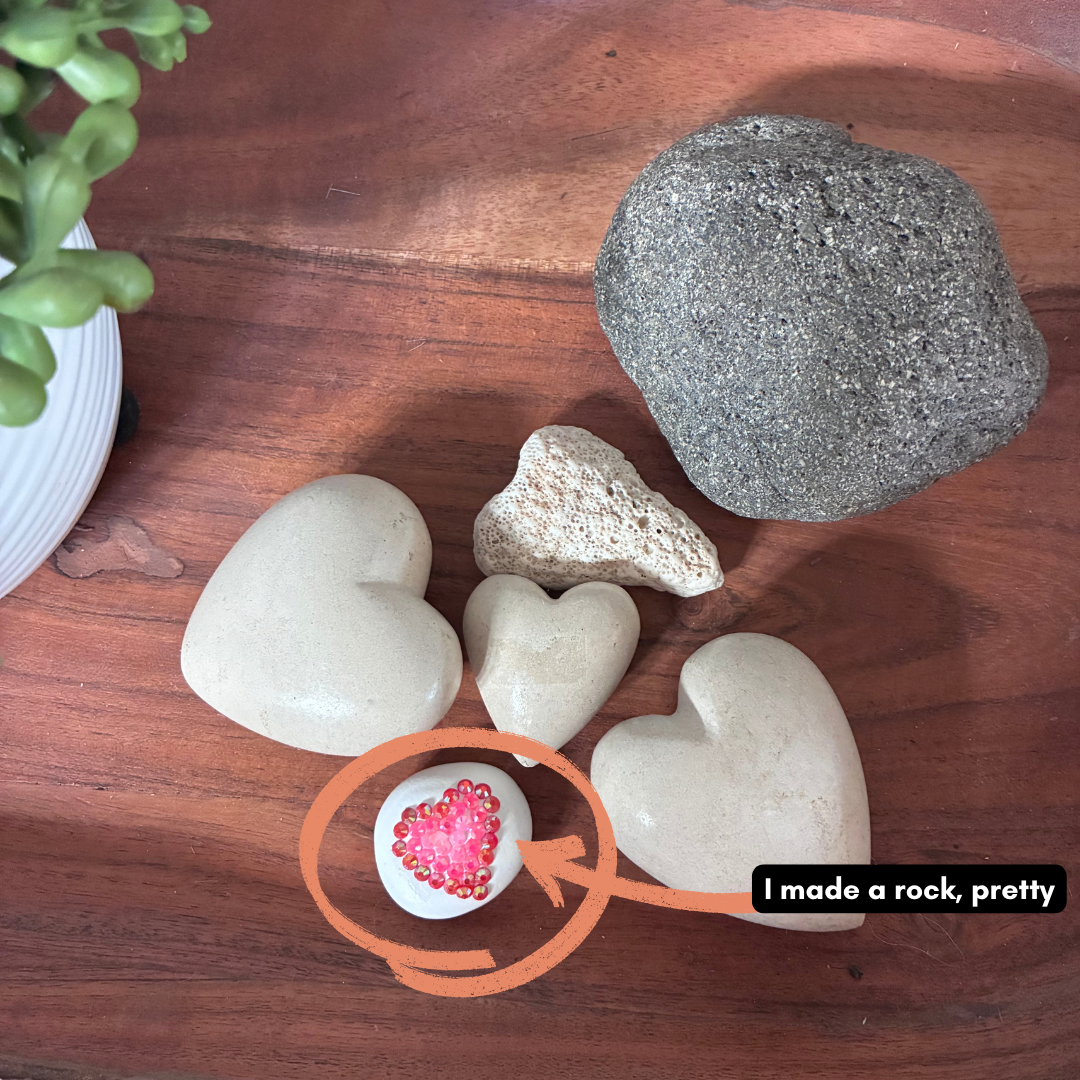 A rock decorated with glued-on gems