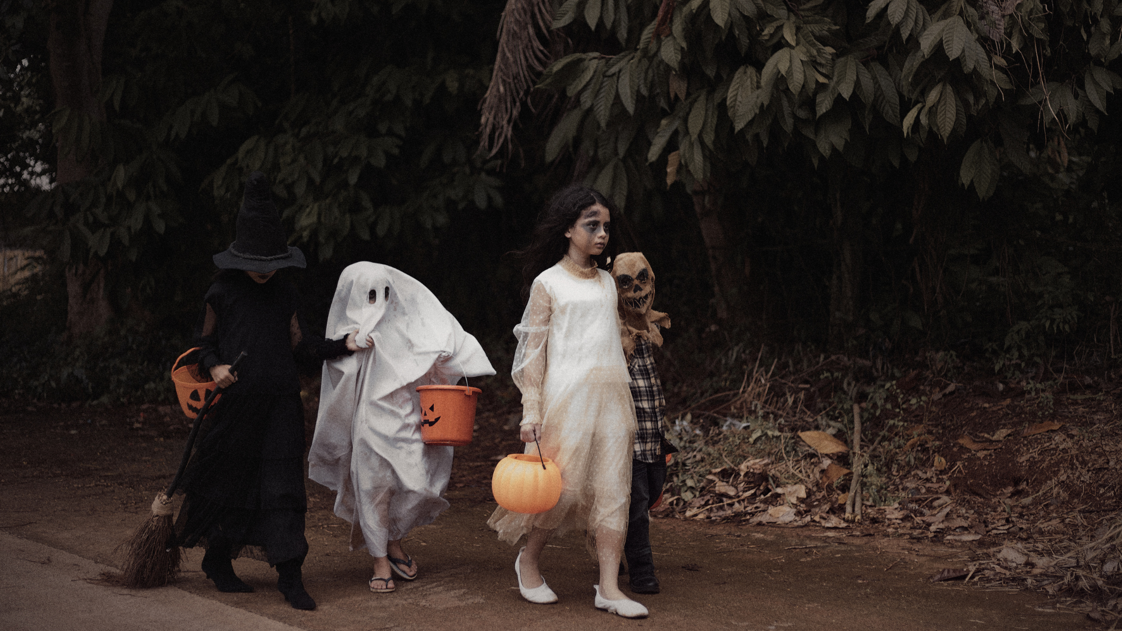 Costumed trick-or-treaters on a downtown Ridgefield sidewalk in October