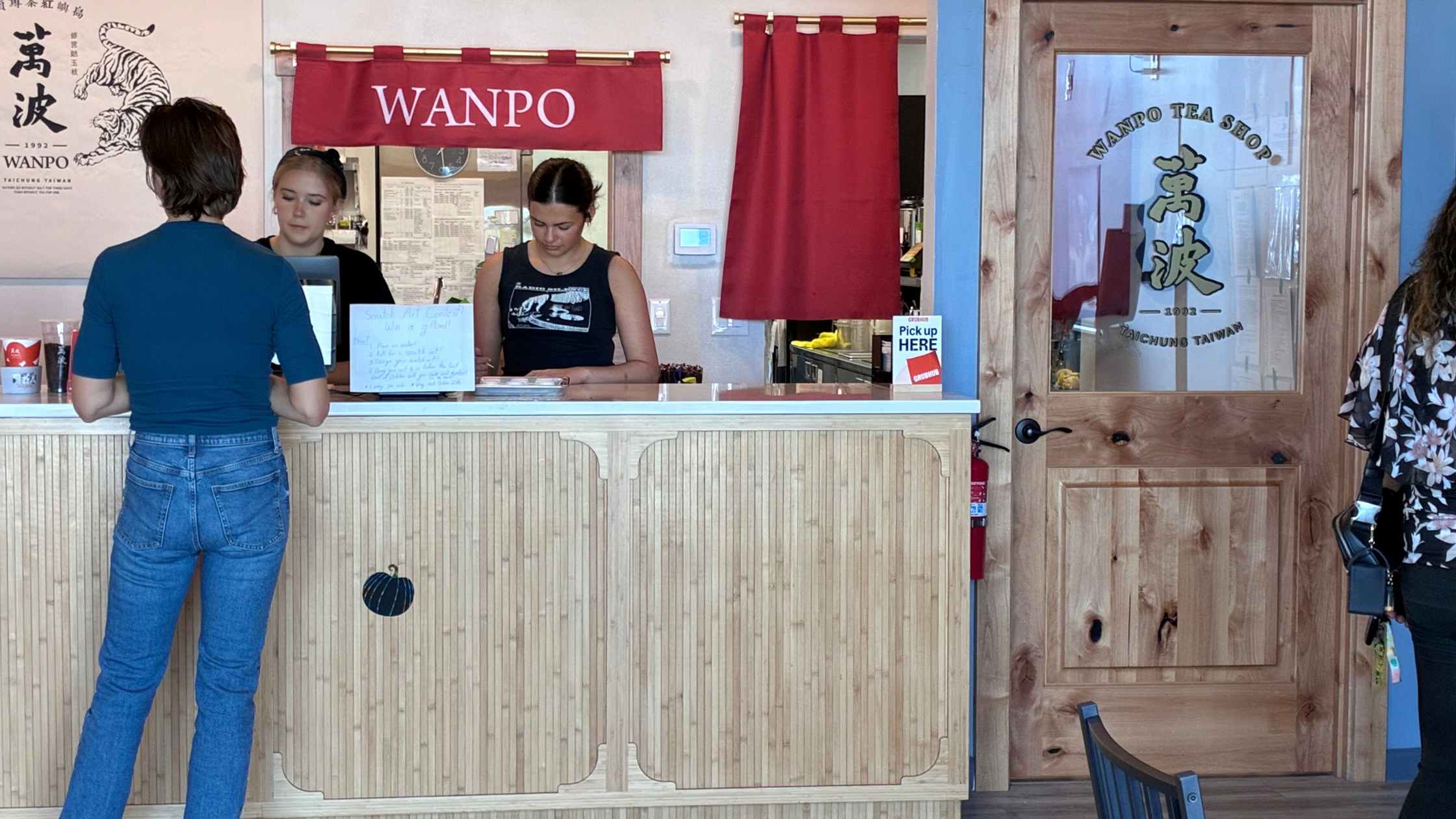 Customers inside Wanpo Tea Shop in Ridgefield, Washington